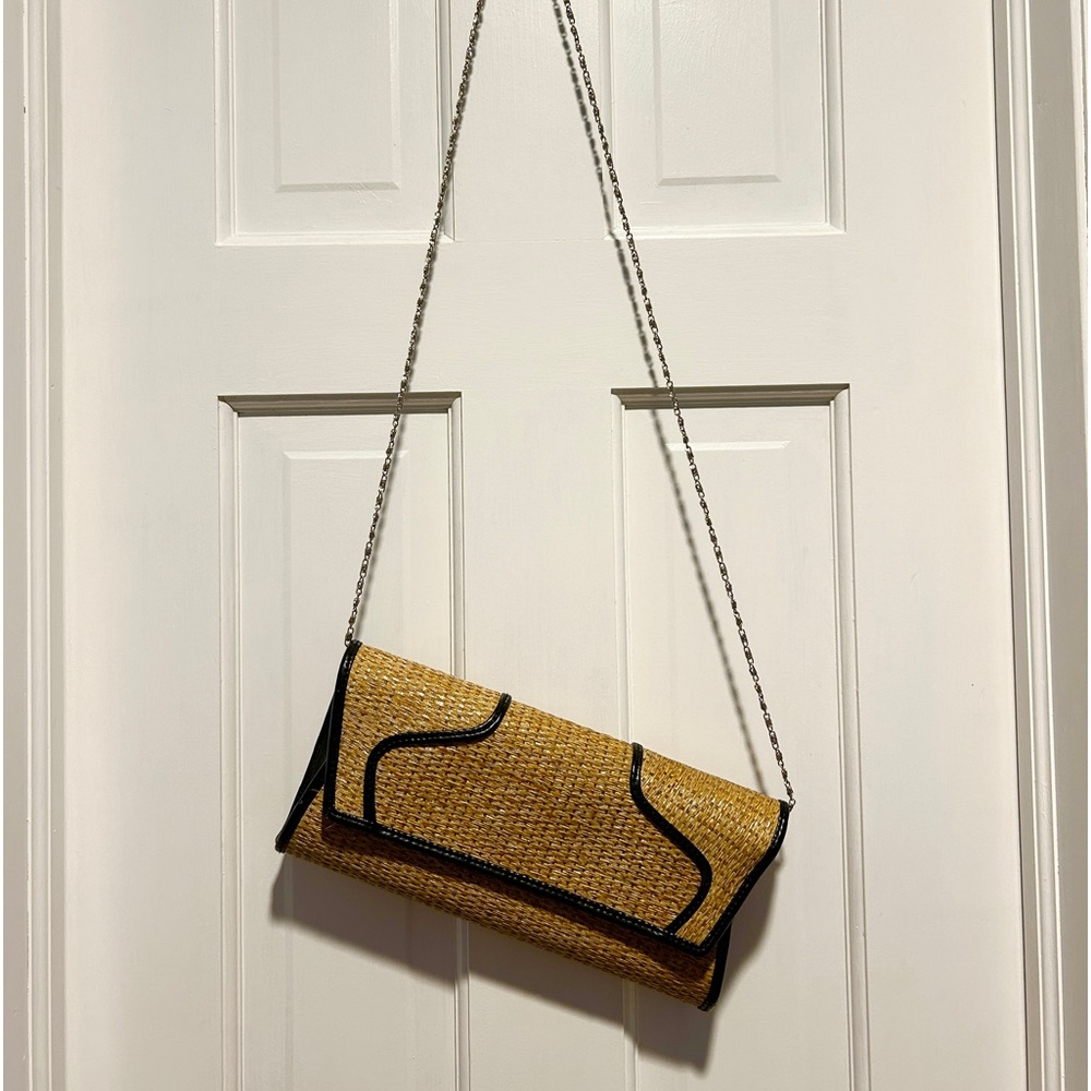 Rattan and faux leather trim bag with long silver chain strap.